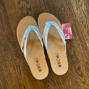 ONCAI silver flip flops NWT